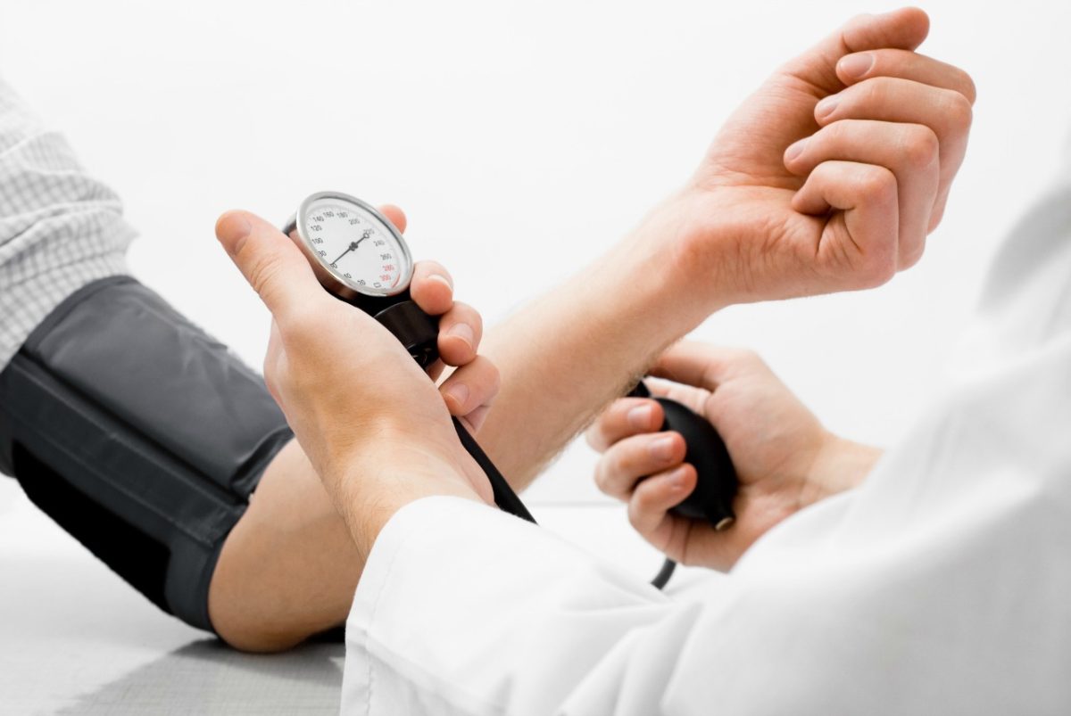 Patient and doctor taking high blood pressure