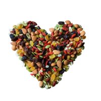 Trail mix in a heart shape with a white background