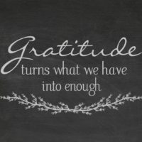 Gratitude turns what we have into enough on a chalk board